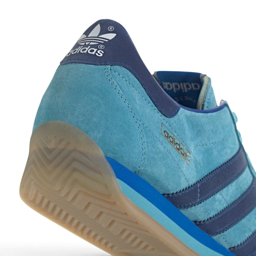 Zoom Looking at the Front of the Shoes and Laces: Macro focus on the toe cap overlay, tonal blue eyelets, and flat matching laces.   