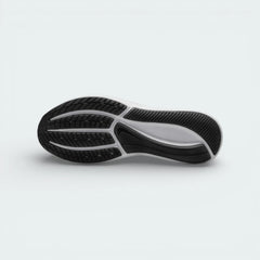 View of the black rubber outsole, showcasing the signature molded star traction pattern and flexible grooves.