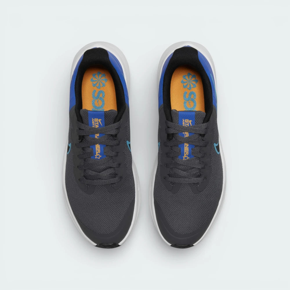 Top-down view of the grey trainers, highlighting the breathable mesh toe box and the secure black lacing system.