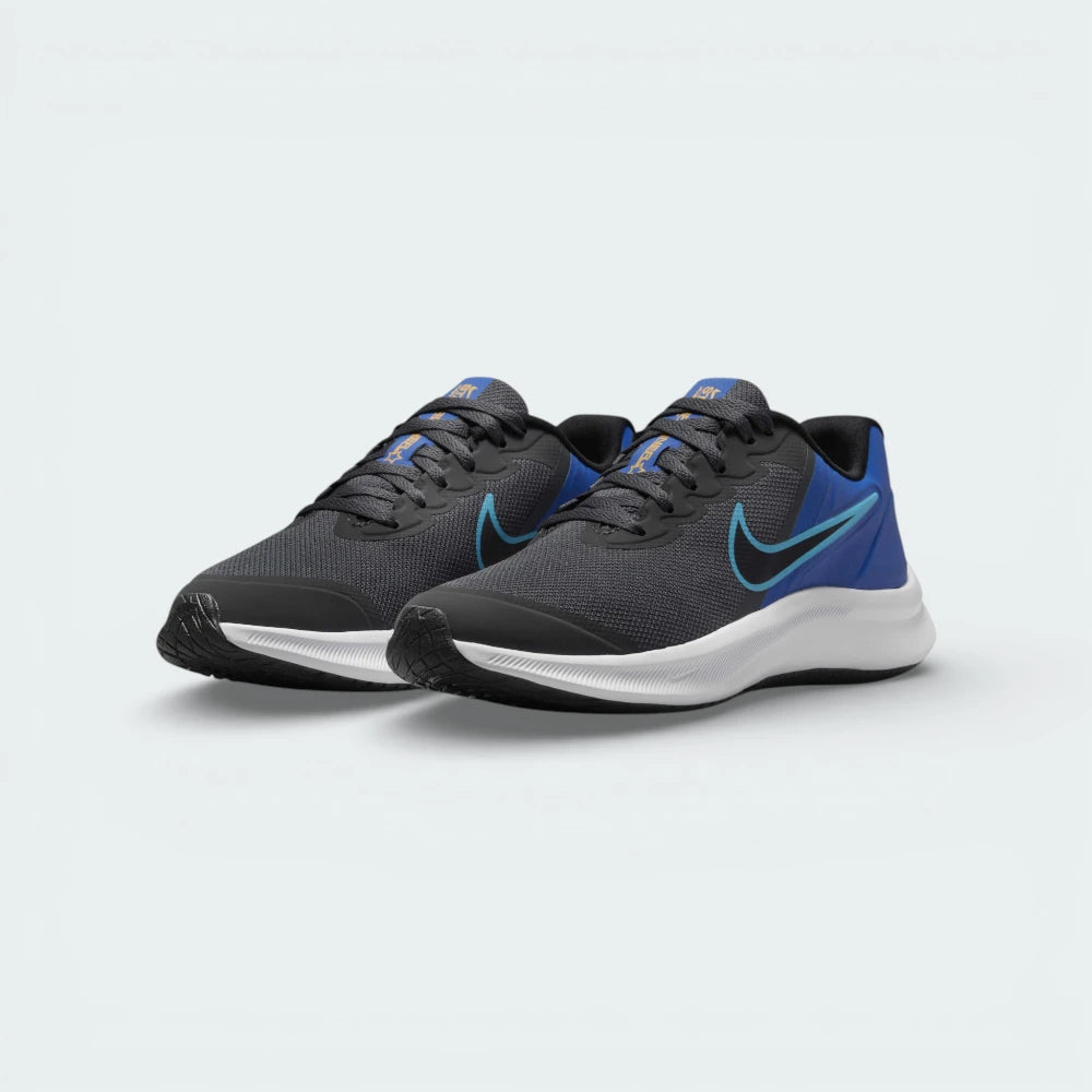 Angled shot of both Nike Star Runner 3 trainers, showcasing the sleek aerodynamic silhouette and the bold blue highlights.