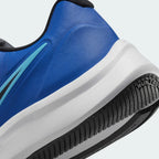 Detailed zoom on the midsole area, highlighting the soft foam cushioning and the transition to the durable star-patterned outsole.