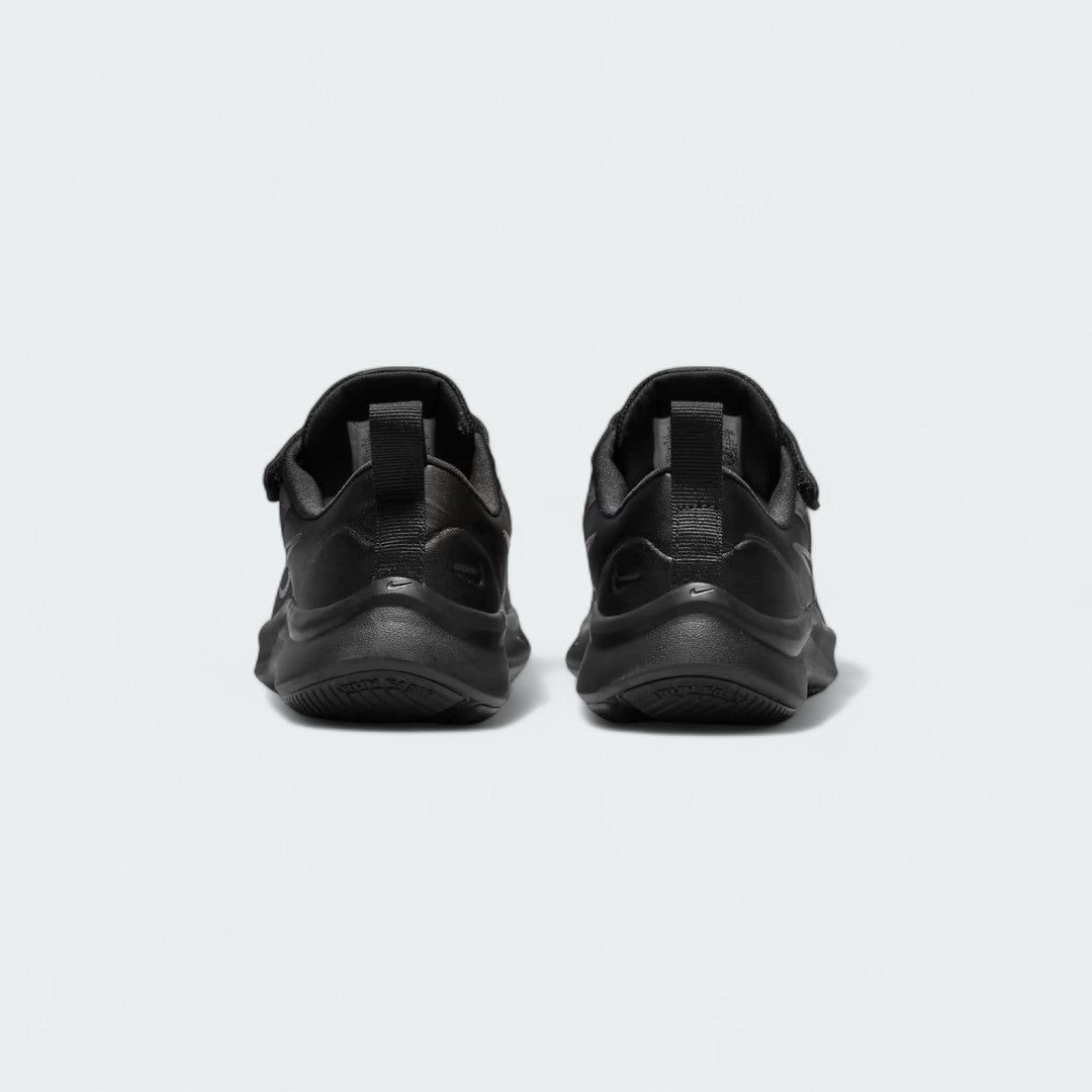 Rear view of the Nike Star Runner 3 Children's black shoes, focusing on the structured heel and subtle branding.