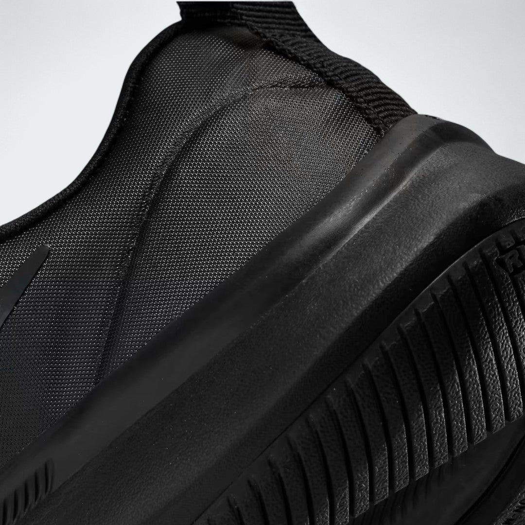 Detailed zoom on the outsole and midsole of the Nike Star Runner 3 Children's black shoes, highlighting the soft foam cushioning and flexible rubber sole.