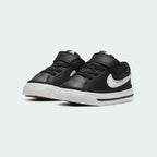 Angled view of two Nike Court Legacy Toddlers' black shoes, side by side, showcasing their classic aesthetic and simple design.