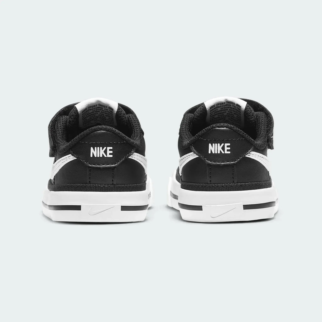 Rear view of the Nike Court Legacy Toddlers' black shoes, focusing on the structured heel and Nike branding.