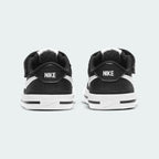 Rear view of the Nike Court Legacy Toddlers' black shoes, focusing on the structured heel and Nike branding.