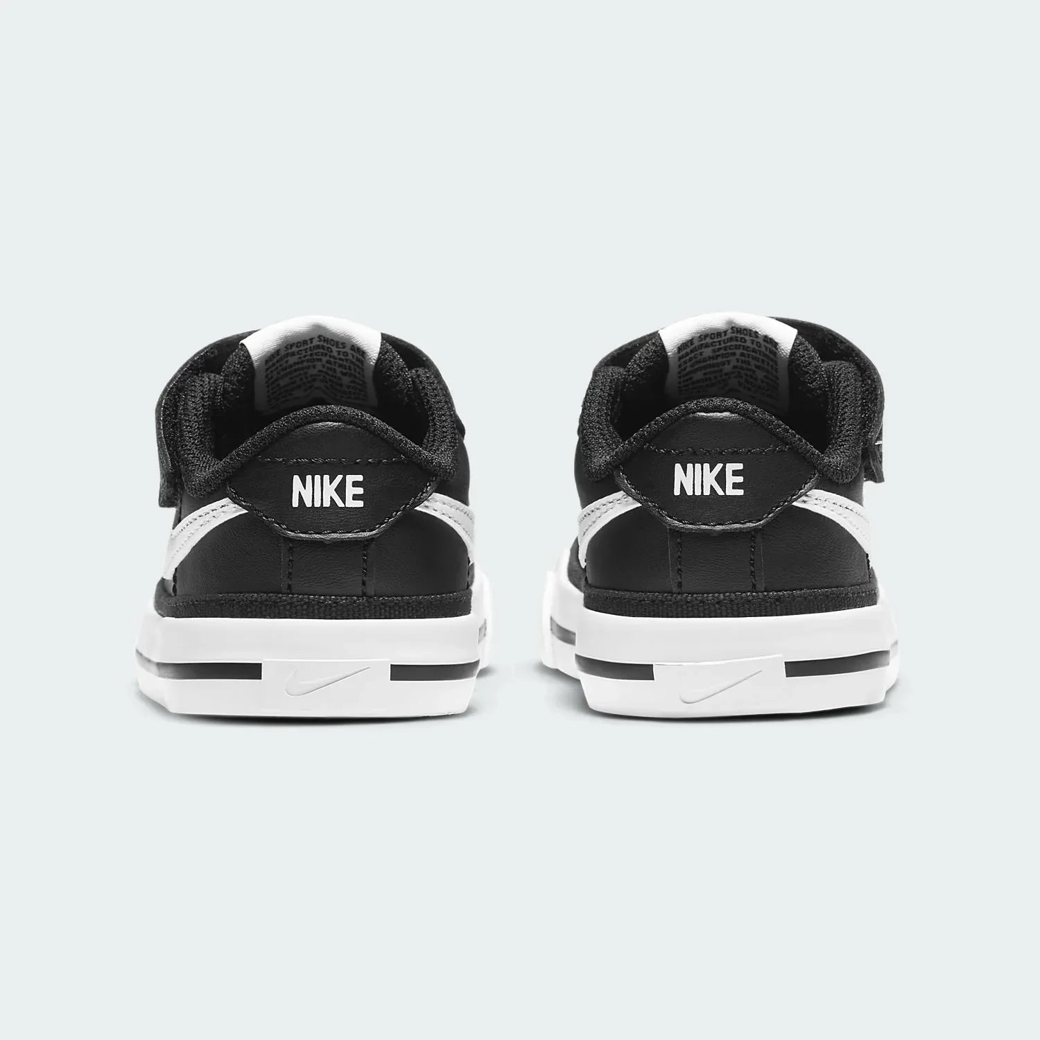 Rear view of the Nike Court Legacy Toddlers' black shoes, focusing on the structured heel and Nike branding.