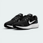 Emphasising the athletic, performance running silhouette and the professional, minimalist distribution of the clean monochrome tones.