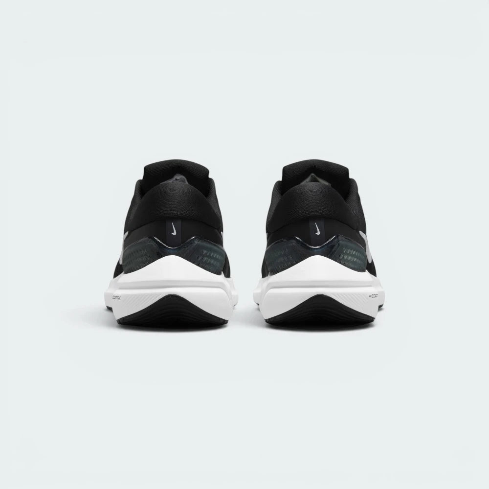 Focuses on the contoured shape of the robust heel clip counter, showcasing a stable, supportive finish built to eliminate rearfoot wobble.
