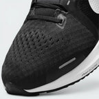 Details the premium dual-stitching lines tracing across the breathable mesh toe box and the precision lace eyelet configuration.