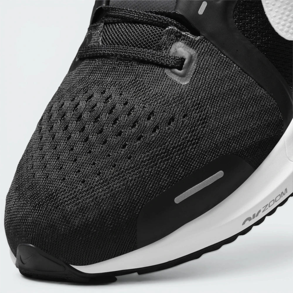 Details the premium dual-stitching lines tracing across the breathable mesh toe box and the precision lace eyelet configuration.