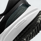 Highlights the "unreal" clean finish where the structural white cushioning wall securely houses the Zoom Air technology above the high-grip black rubber base.