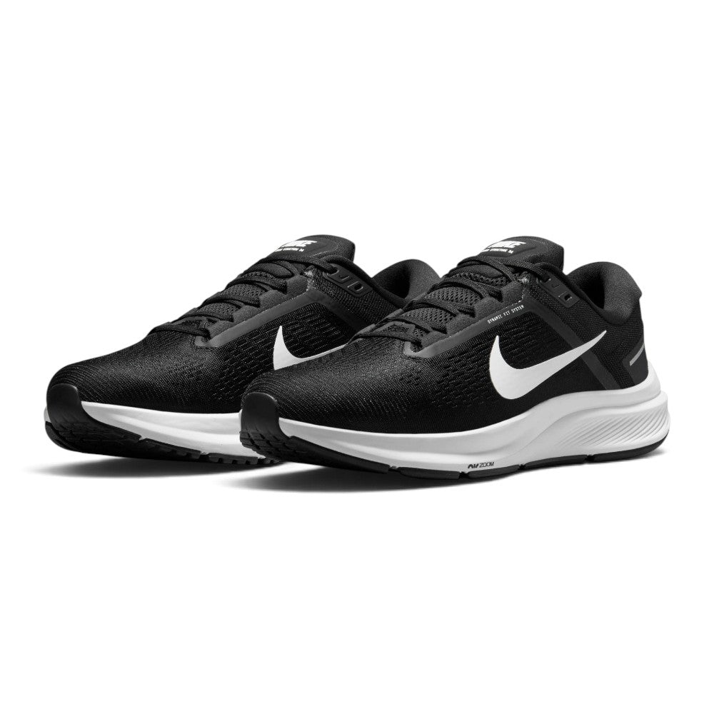 Emphasising the planted, supportive road-running stance and the crisp contrast between the all-black engineered mesh body, dynamic eyestay bands, and clean white midsole tooling.