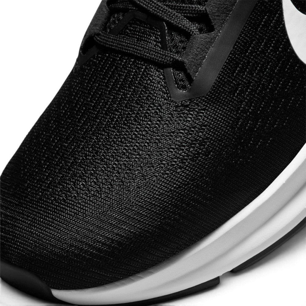 Details the micro-precision of the forefoot area, showing the open-pore engineered mesh ventilation zones across the toe box, reinforced synthetic eyestay overlays, and flat black laces.