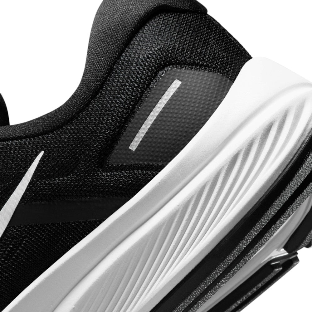Highlights the "unreal" clean finish of the rear lateral quarter, showcasing the grooved white foam midsole texture, synthetic heel overlay with reflective strip, and the trailing tip of the white Swoosh.