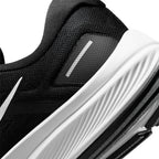 Highlights the "unreal" clean finish of the rear lateral quarter, showcasing the grooved white foam midsole texture, synthetic heel overlay with reflective strip, and the trailing tip of the white Swoosh.