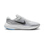 Highlights the structured lateral silhouette showing the Pure Platinum engineered mesh upper, bold black Nike Swoosh extending across the midfoot, sculpted white foam midsole, and durable black rubber outsole.