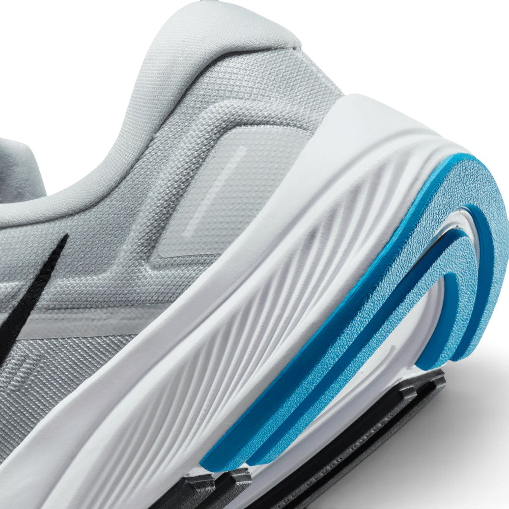 Highlights the "unreal" clean finish where the sculpted white foam midsole meets the lateral rubber crash rail and responsive forefoot Zoom Air boundary.
