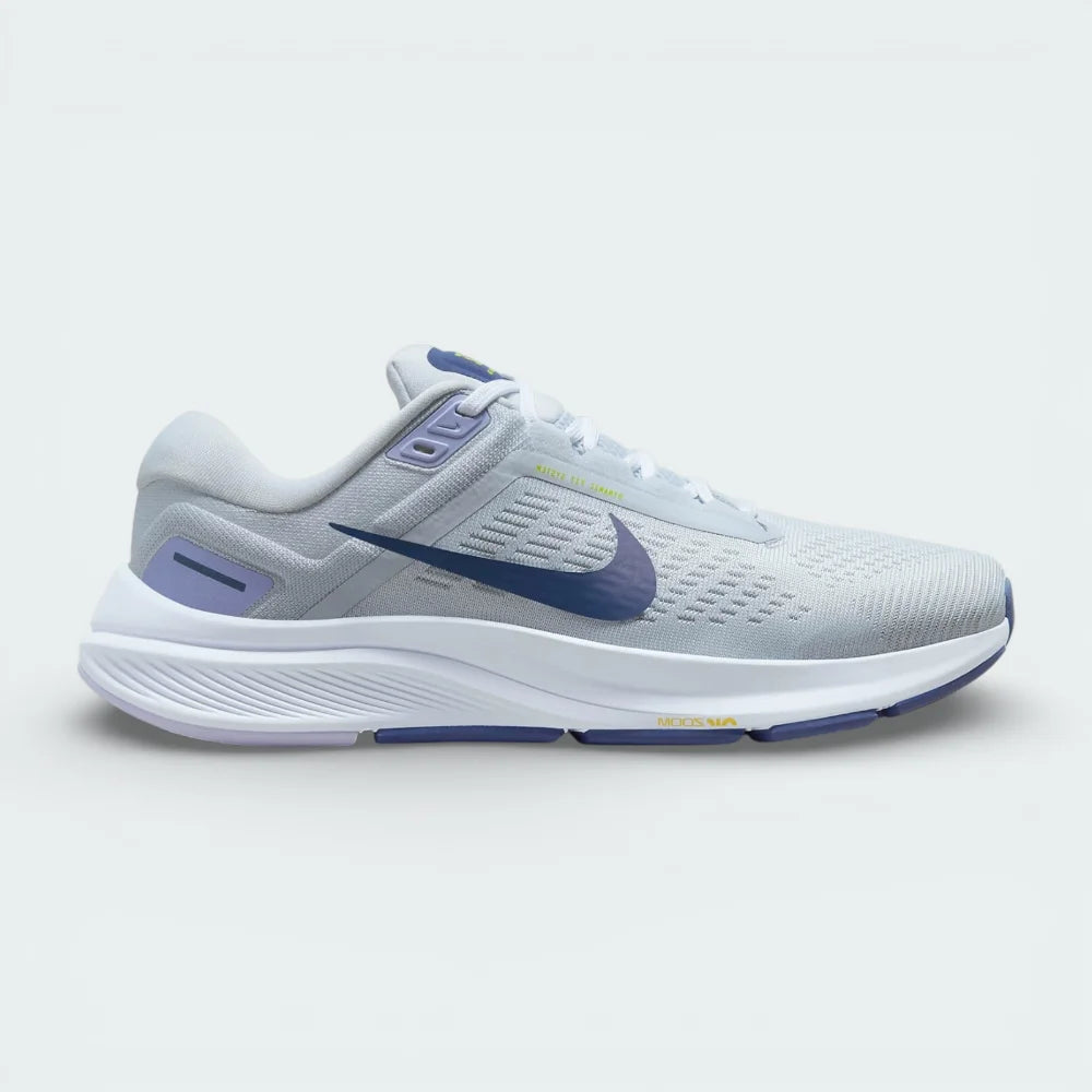 Side profile of the Nike Air Zoom Structure 24 Women's trainers in Pure Platinum, showing the Diffused Blue Swoosh and the supportive foam midsole.