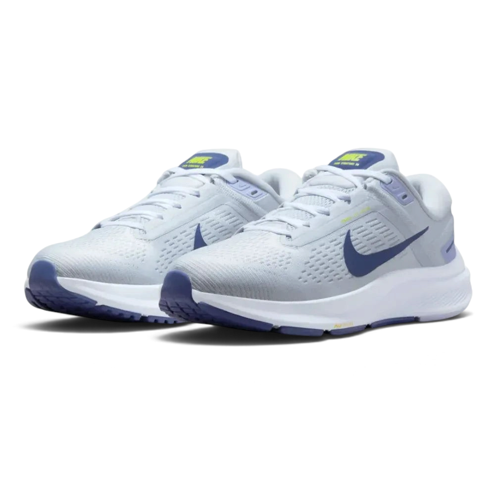 Angled shot of both Nike Air Zoom Structure 24 trainers side by side, showcasing the clean platinum aesthetic and soft blue accents.