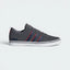 Highlights the high-velocity red accents and the professional depth of the grey synthetic nubuck.