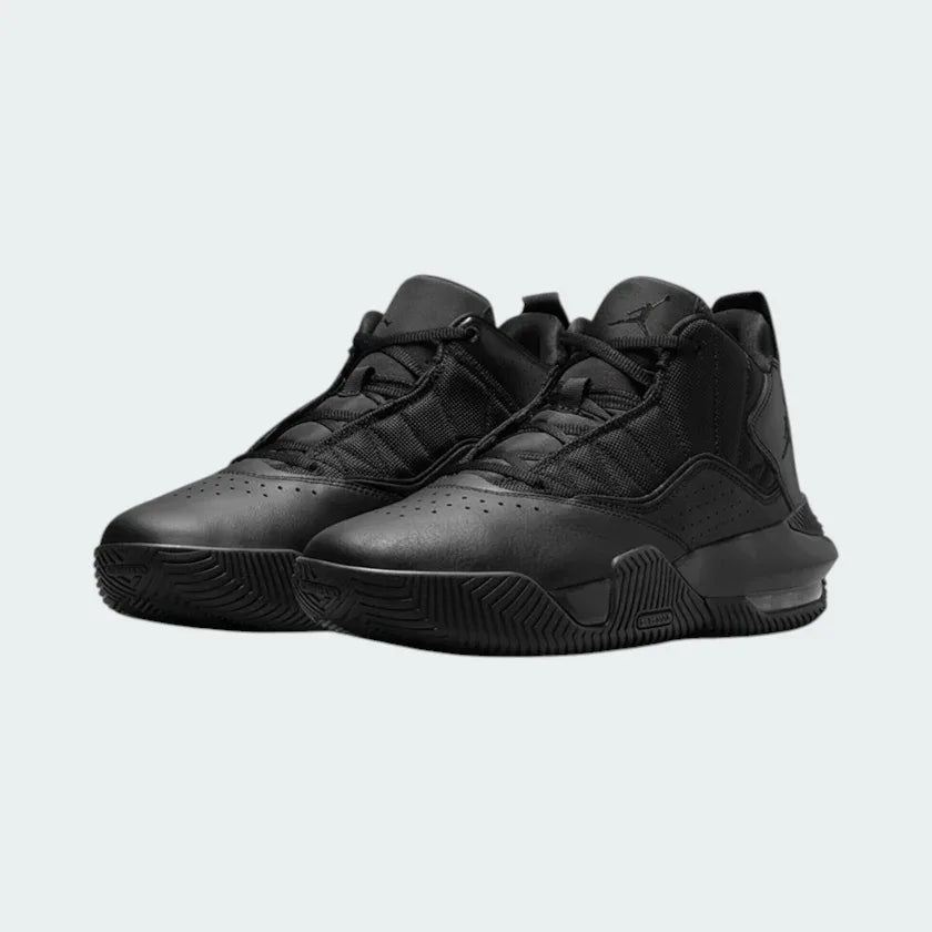 Angled view of two Jordan Stay Loyal men's black and grey trainers, side by side, showcasing their unique hybrid design.