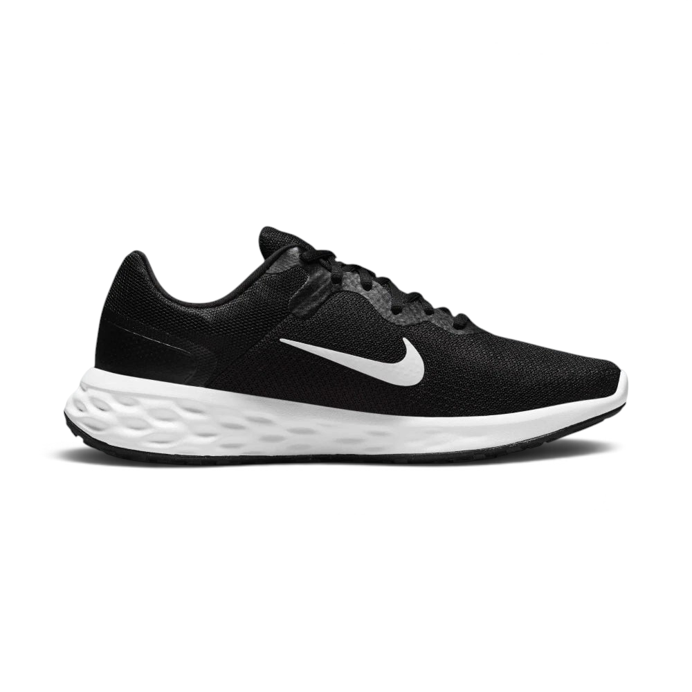 Black golf shoe with a white sole on a white background