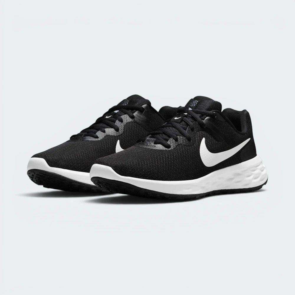 Emphasising the low-slung, forward-leaning athletic running stance and the professional harmony of the deep black uppers sitting cleanly above the white and dark iron grey sole tooling components.