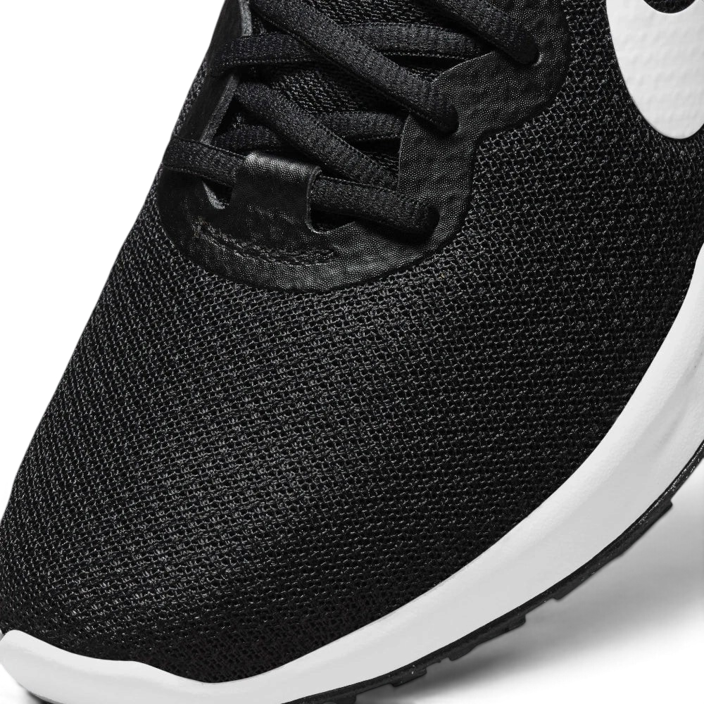 Details the premium precision of the seamless overlays wrapping the front toe cap to defend against debris, showing off the breathable perforations in the mesh up close.