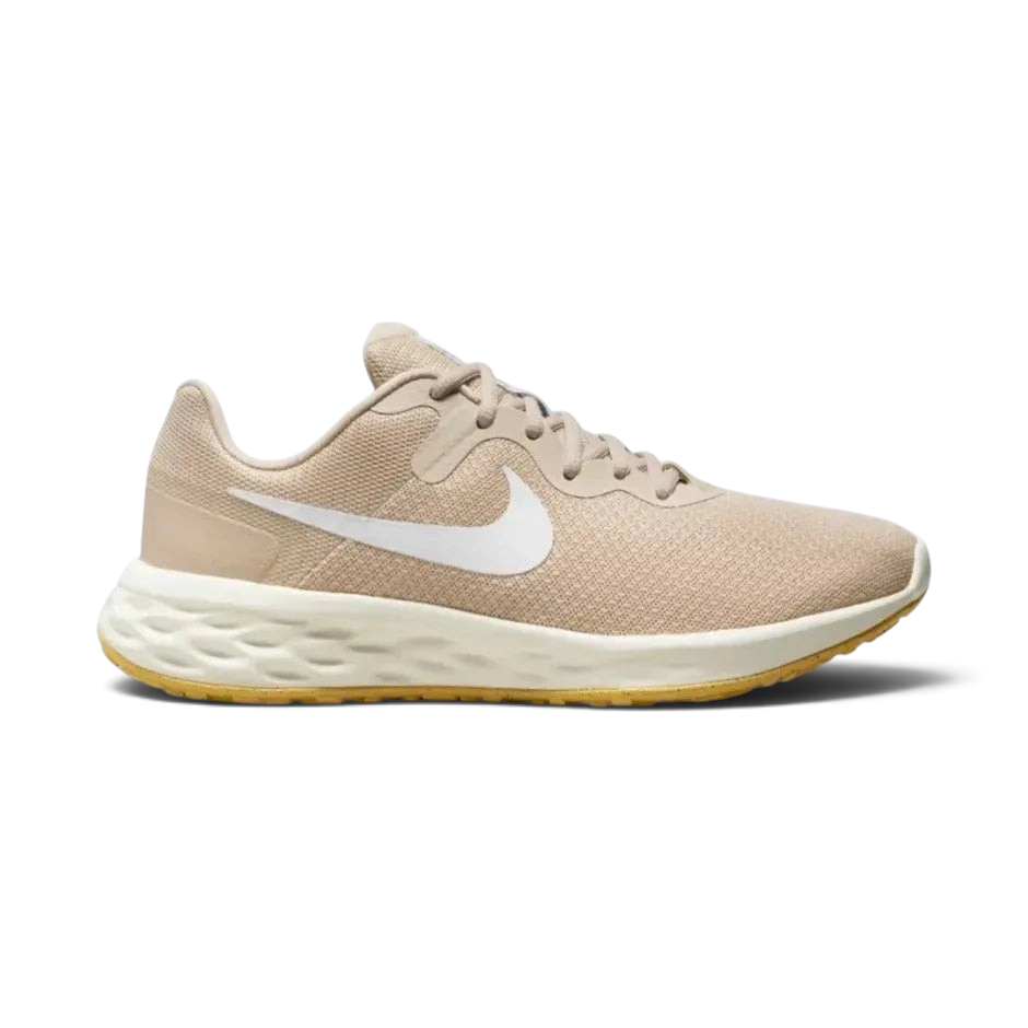 Side profile of the Nike Revolution 6 in Sand Drift, showing the white Swoosh, Topaz Gold accents, and the clean white foam midsole. Main image