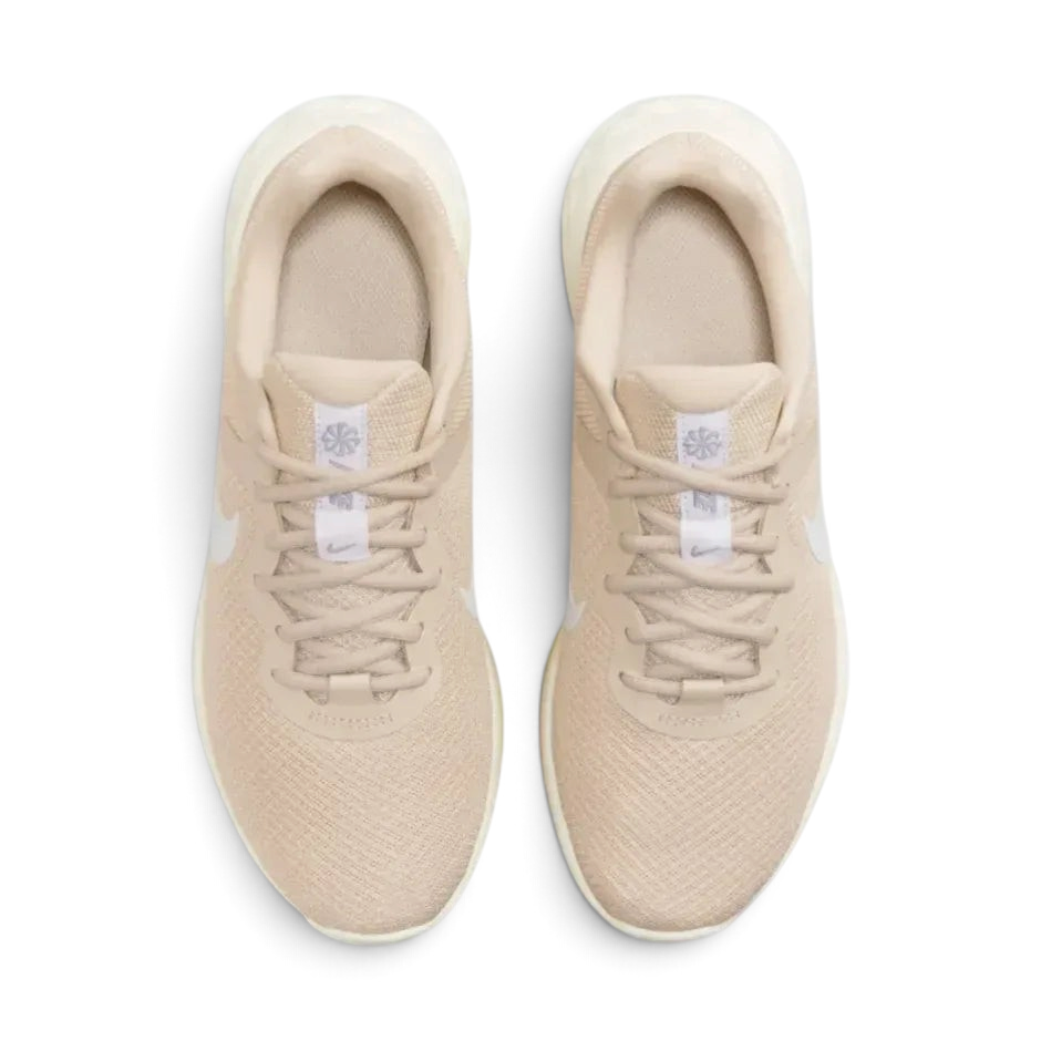 Top-down view of the women's Revolution 6 trainers, highlighting the light brown mesh texture and the secure Sand Drift lacing system.