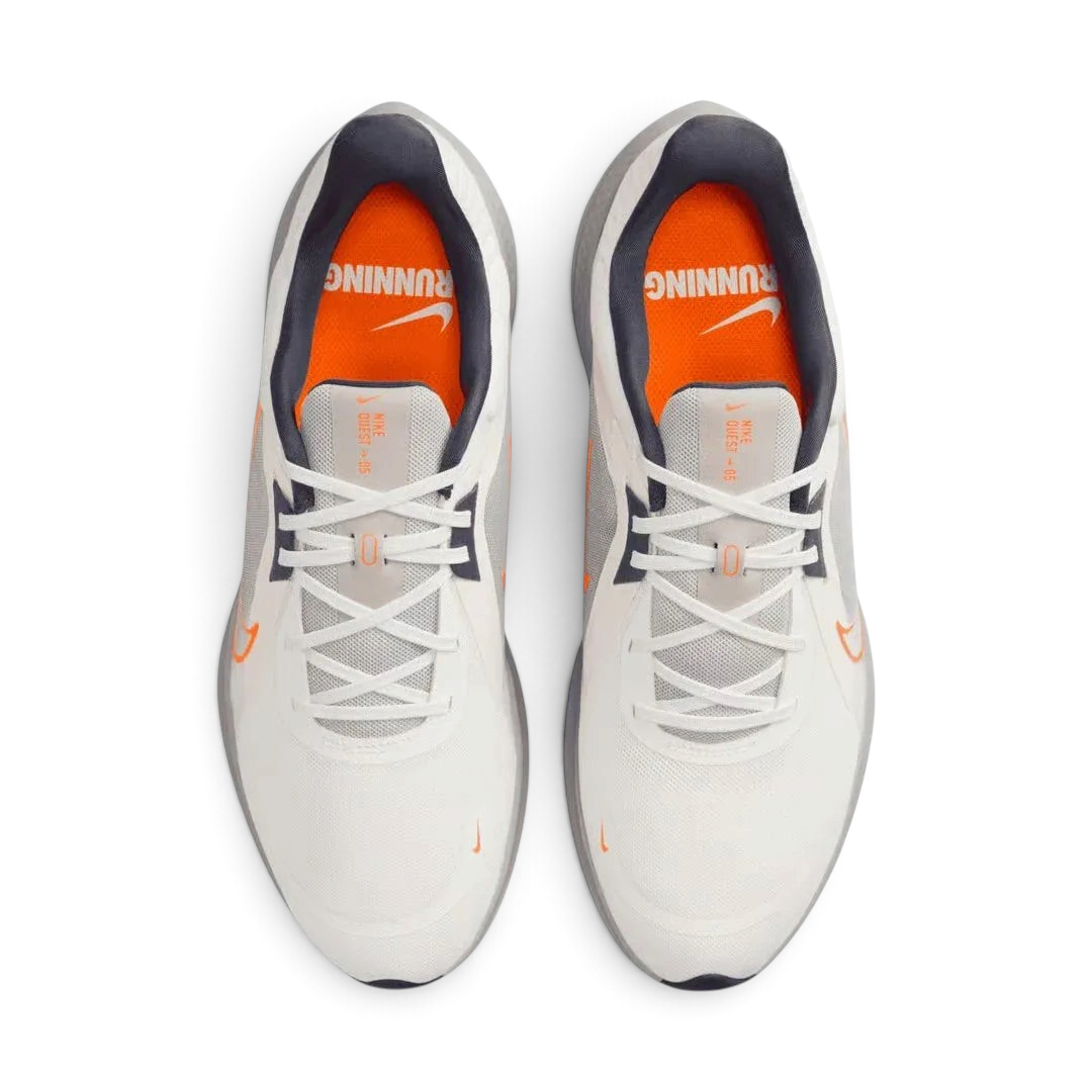 Top-down view of a pair of Nike Quest 5 Men's running shoes in sail, highlighting their breathable mesh construction and lacing system.