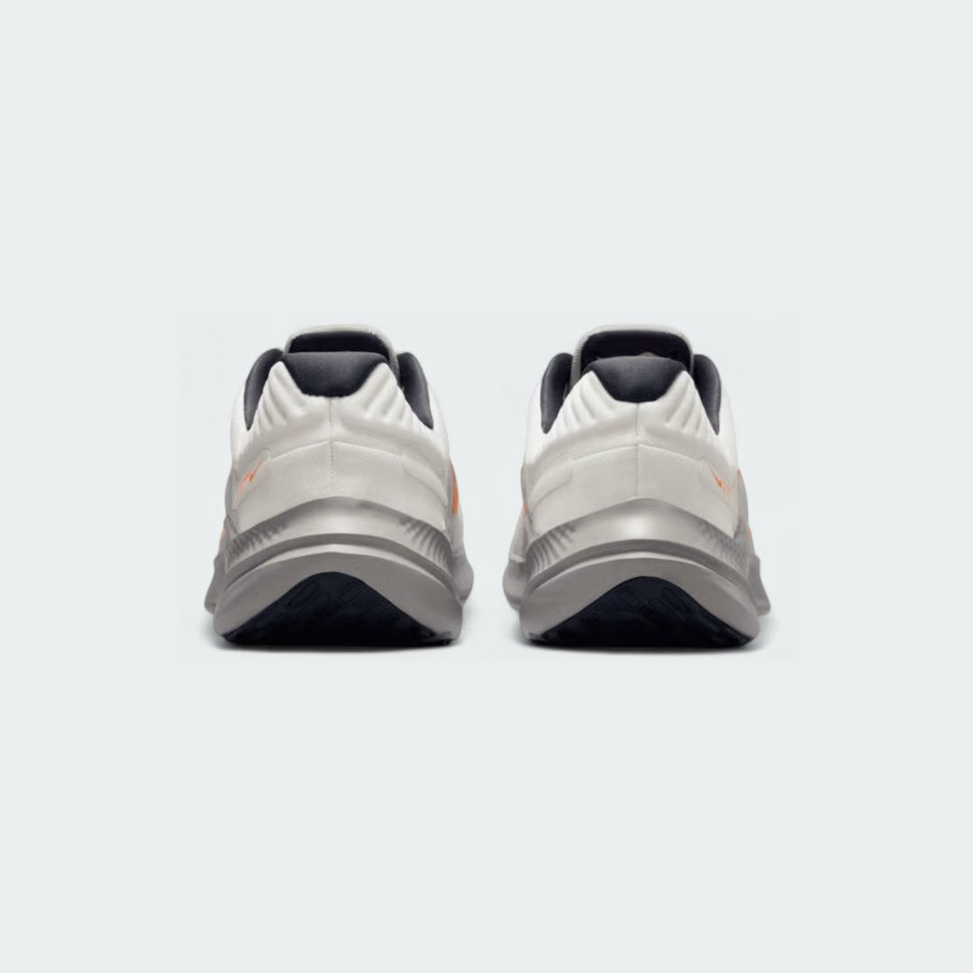 Rear view of the Nike Quest 5 Men's running shoes, focusing on the supportive heel collar and subtle branding.
