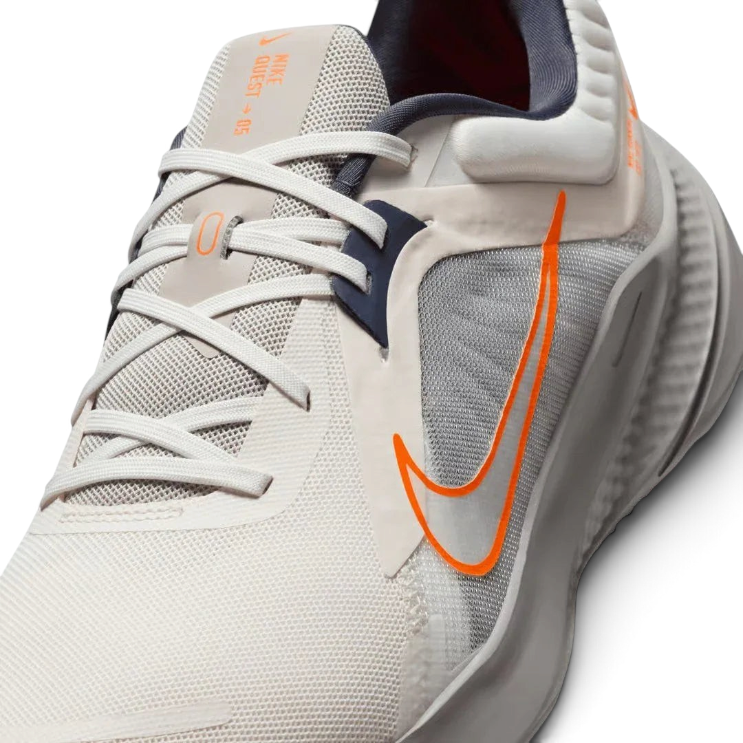 Close-up zoom on the front of the Nike Quest 5 Men's running shoes, showing the mesh upper texture and integrated lacing system.