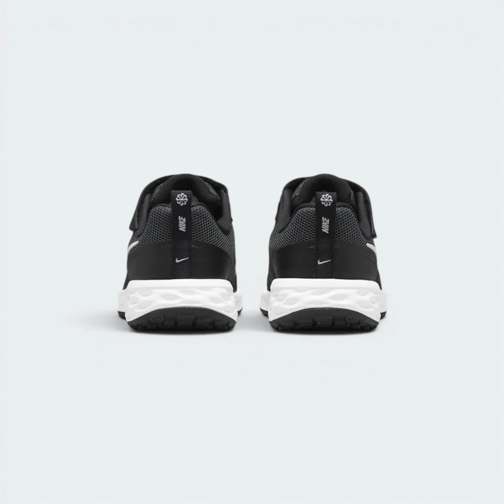 Focuses on the contoured shape of the black heel overlays, showing a professional finish built to keep ankles supported.