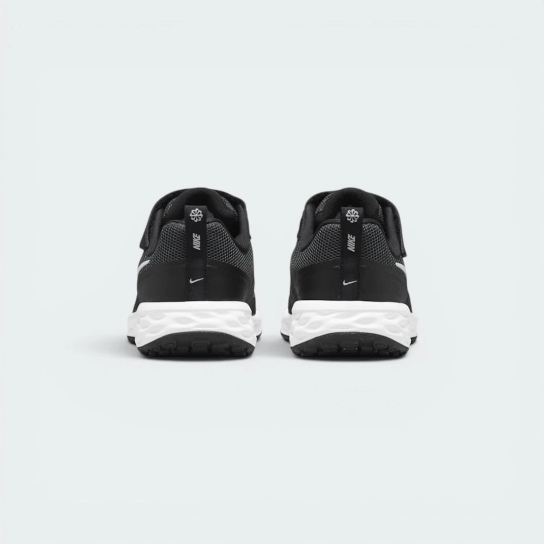 Focuses on the contoured shape of the black heel overlays, showing a professional finish built to keep ankles supported.