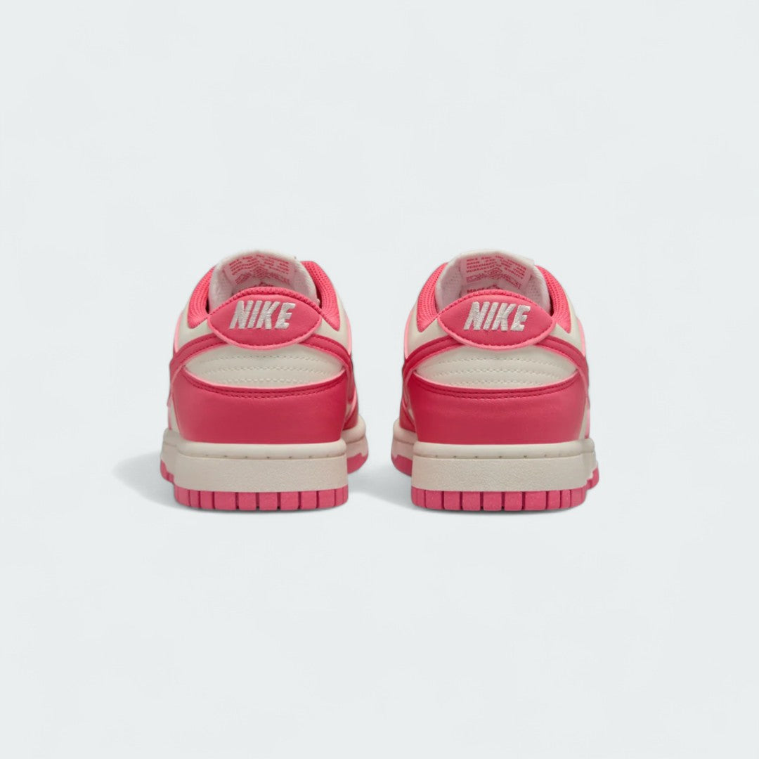 Rear view of the Nike Dunk Low Next Nature Women's pink trainers, focusing on the heel panel and Nike branding.