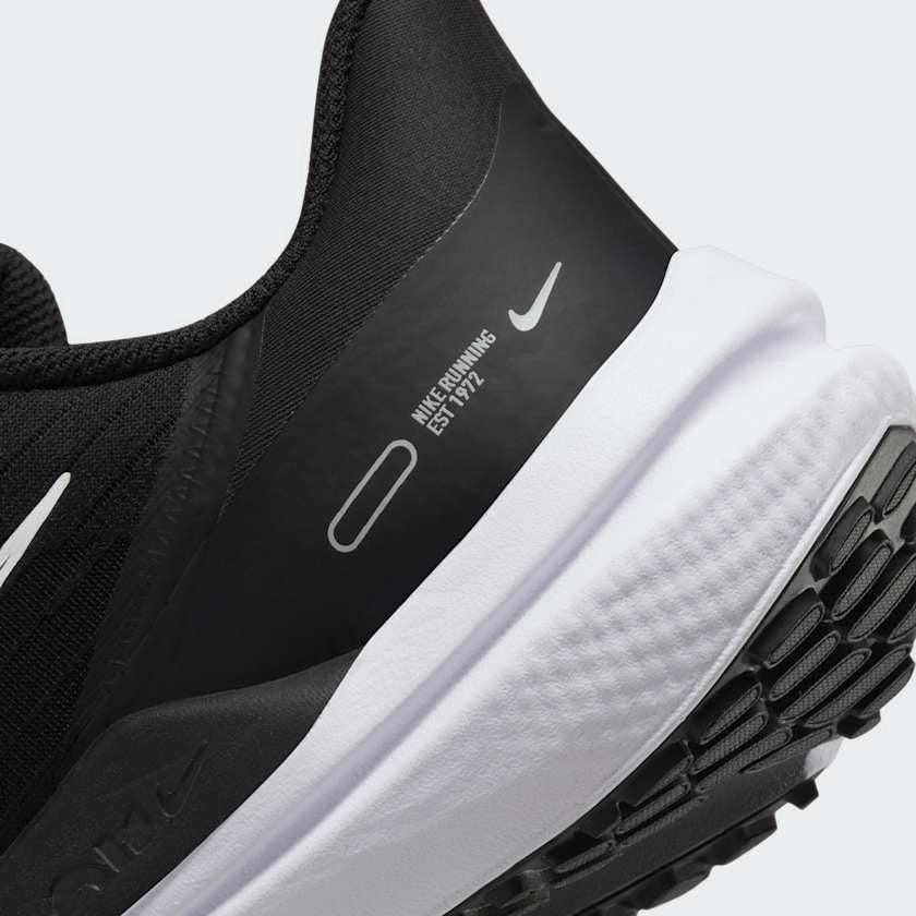 Rear underside close-up of Nike Air Winflo 9 Women's Black Running Shoes DD8686-001 heel area and outsole grip pattern