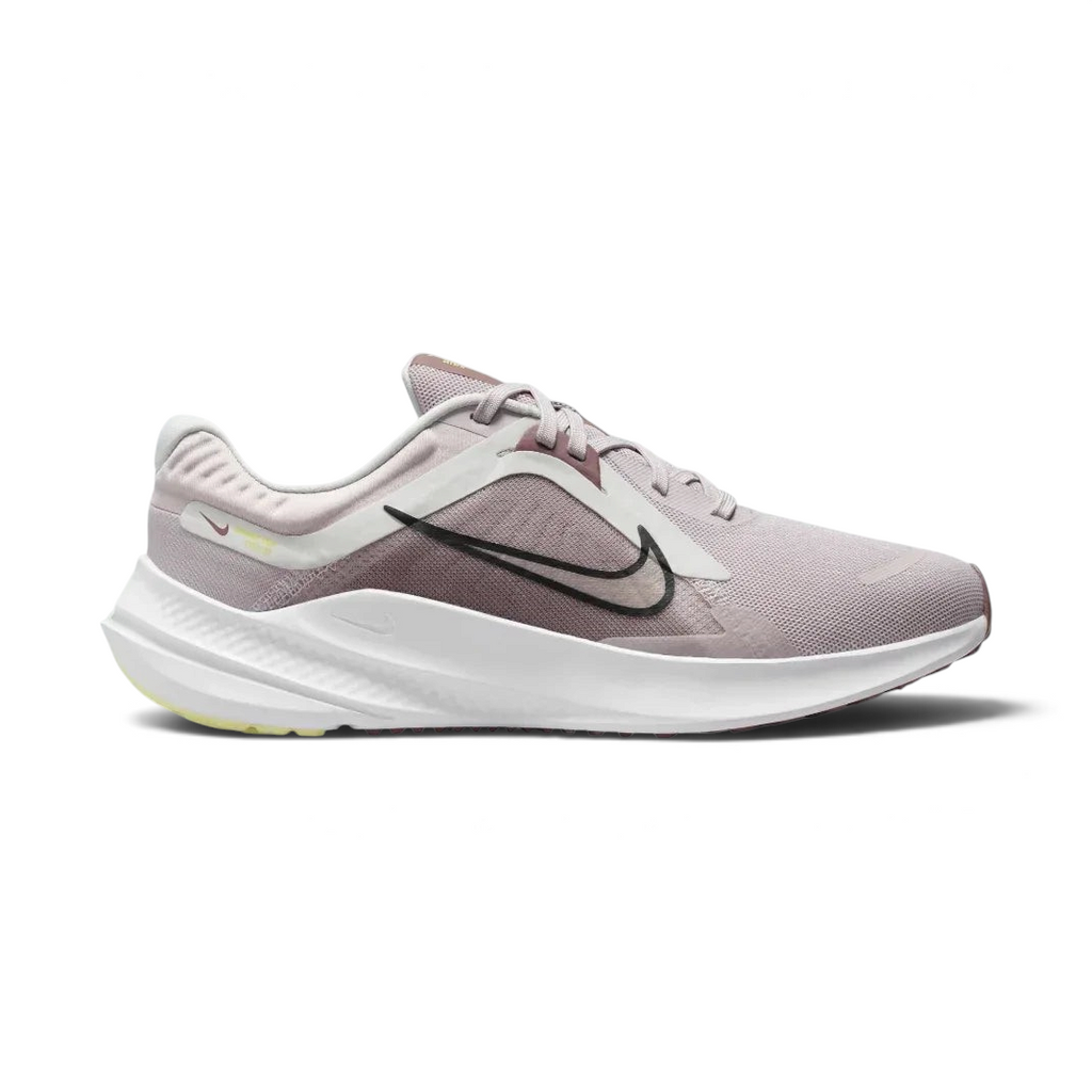 Nike Quest 5 Women's running shoes in platinum violet, side profile showing the black Swoosh, lightweight mesh upper, and the elevated foam midsole.