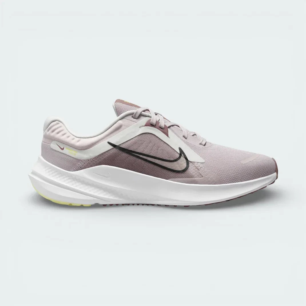 Nike Quest 5 Women's running shoes in platinum violet, side profile showing the black Swoosh, lightweight mesh upper, and the elevated foam midsole. Main image