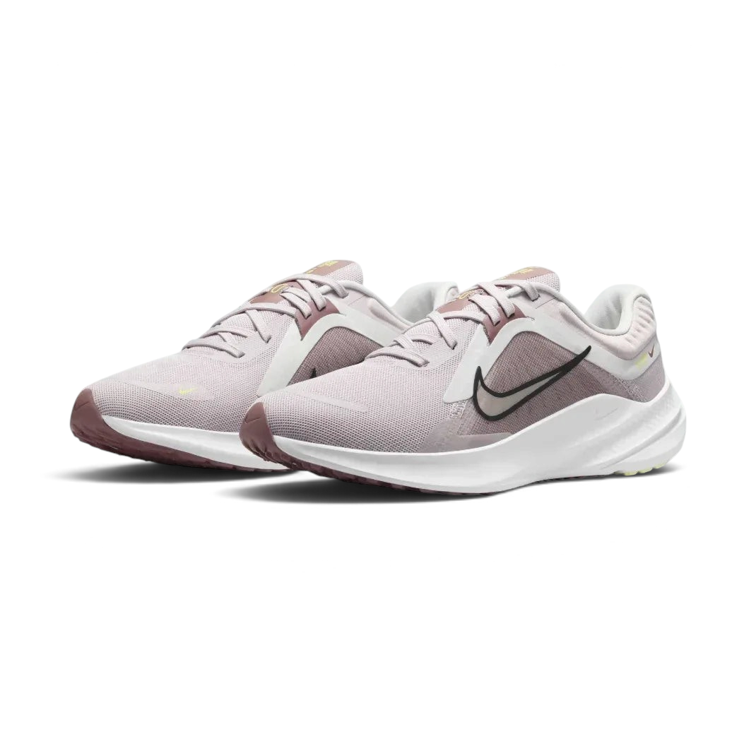 Angled view of two Nike Quest 5 Women's shoes side by side, showcasing the sleek violet design and modern running silhouette.