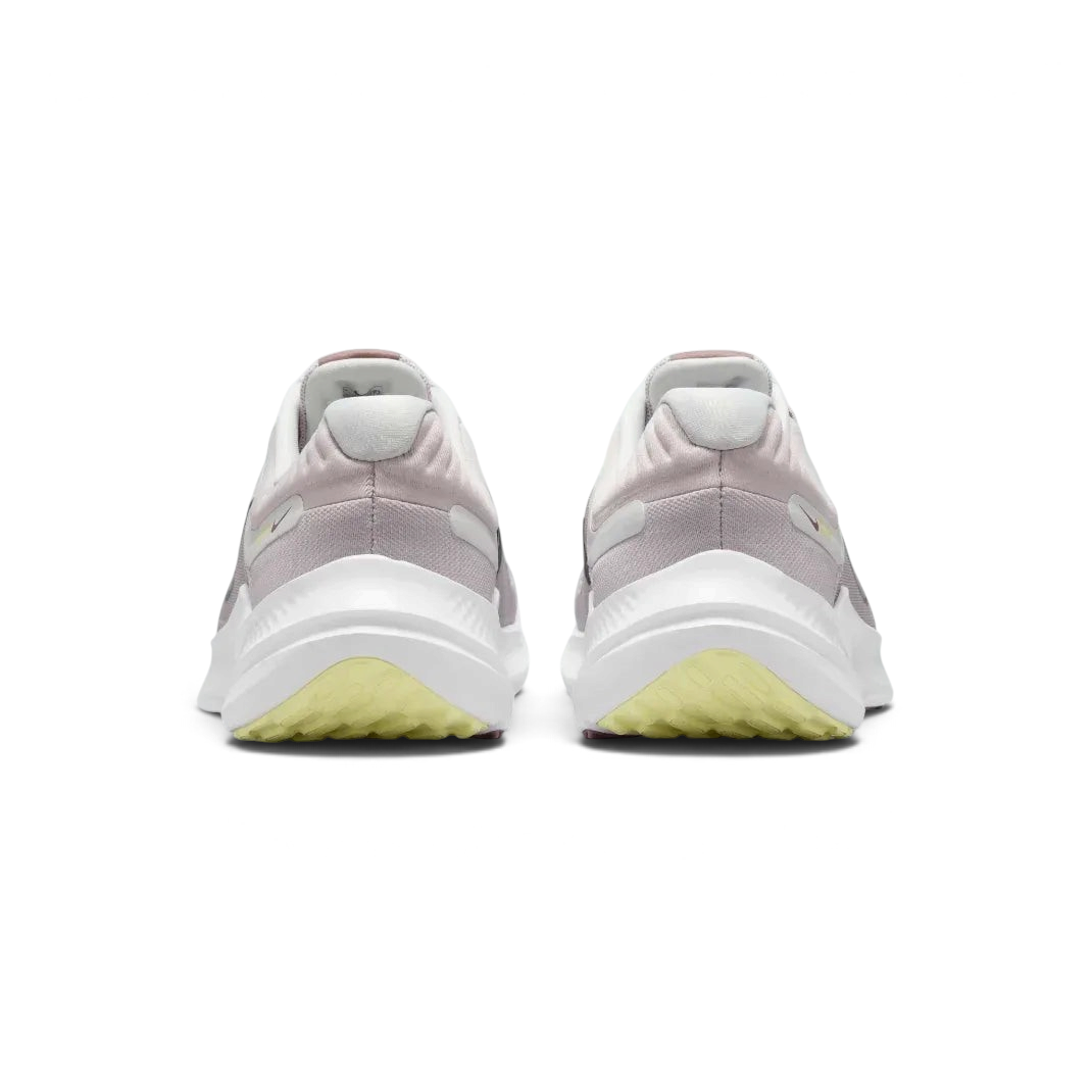 Rear view of the violet shoes focusing on the padded heel collar and the clean transition into the white and purple midsole.