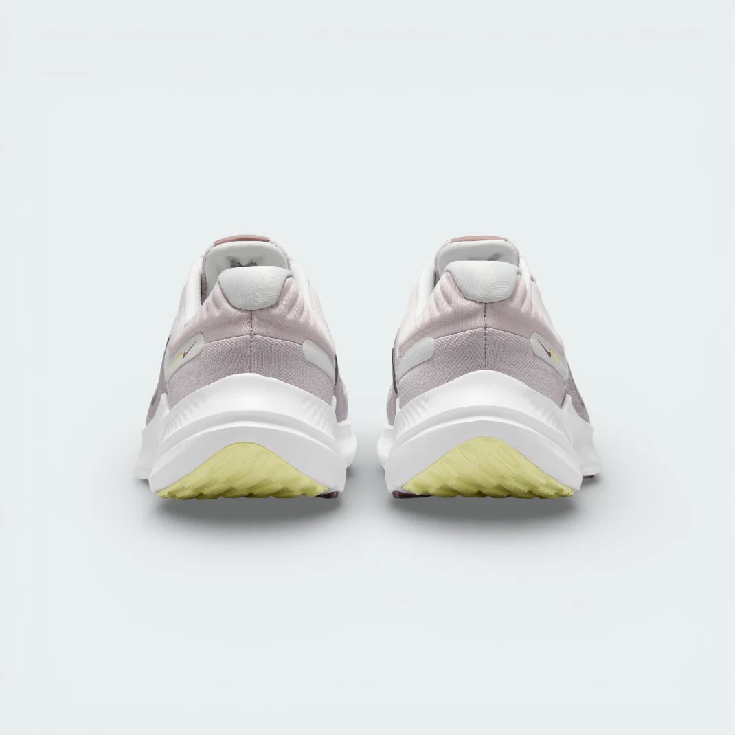 Rear view of the violet shoes focusing on the padded heel collar and the clean transition into the white and purple midsole.