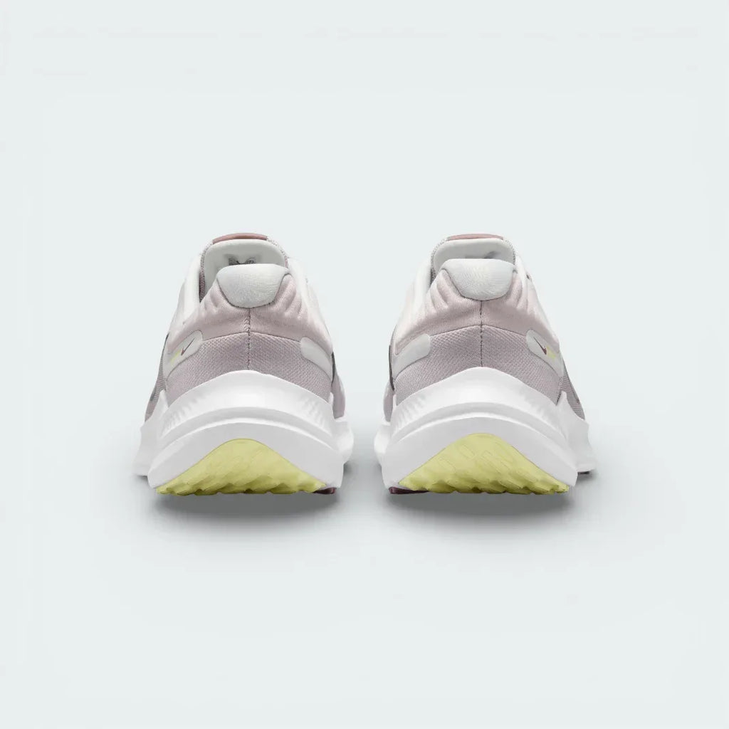 Rear view of the violet shoes focusing on the padded heel collar and the clean transition into the white and purple midsole.
