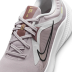 Close-up of the front of the Nike Quest 5, showing the fine detail of the platinum violet mesh and the secure midfoot lacing system.