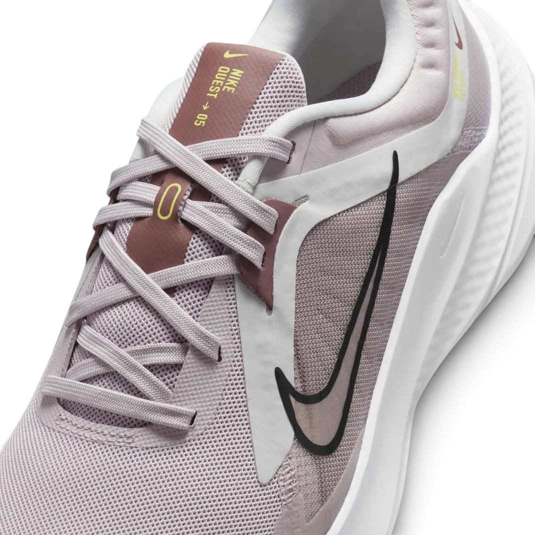 Close-up of the front of the Nike Quest 5, showing the fine detail of the platinum violet mesh and the secure midfoot lacing system.