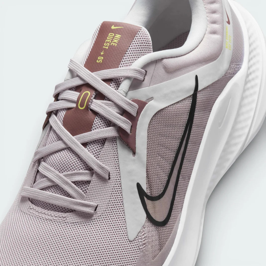 Close-up of the front of the Nike Quest 5, showing the fine detail of the platinum violet mesh and the secure midfoot lacing system.