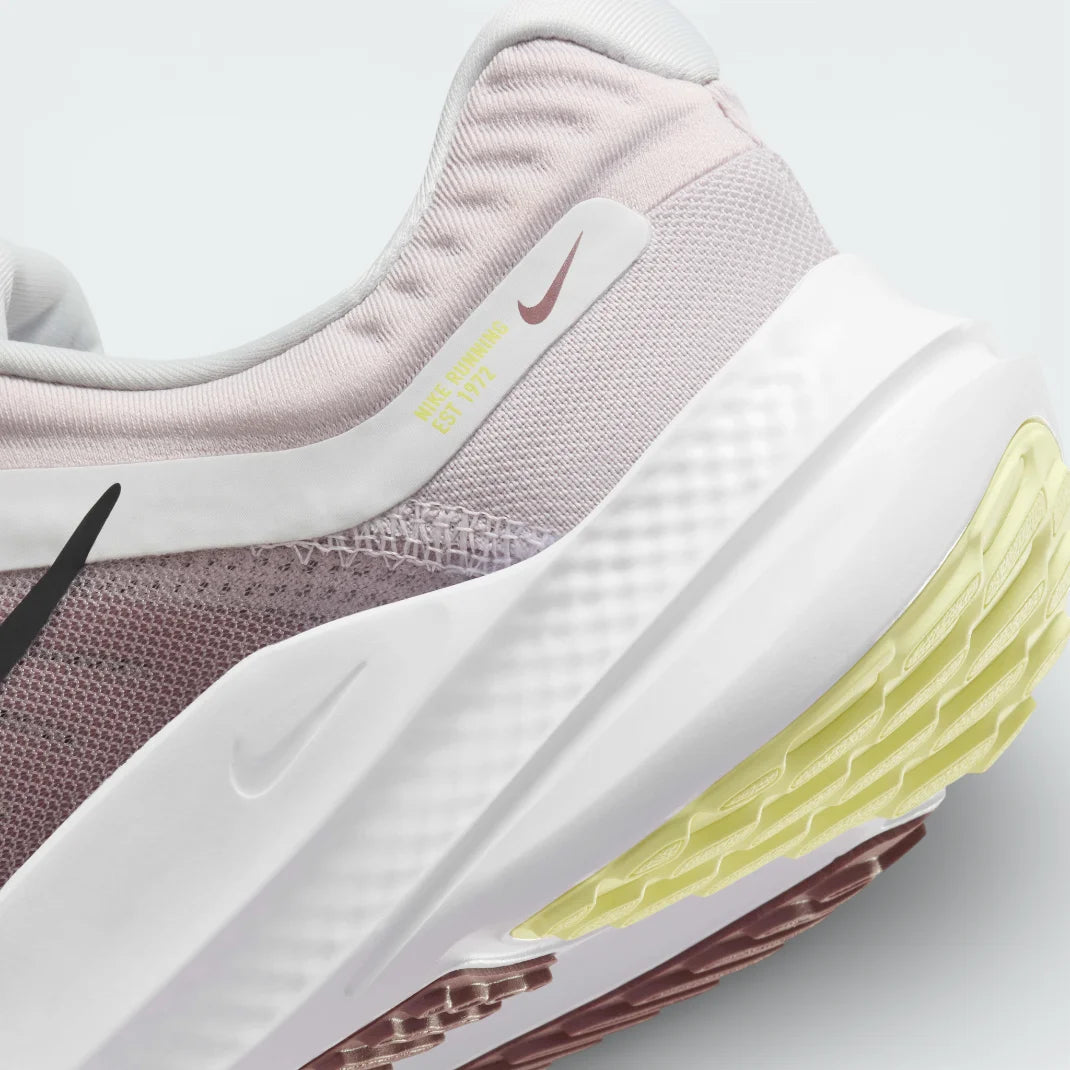 Detailed zoom on the side of the shoe, highlighting the soft foam midsole construction and the durable rubber edge of the outsole.