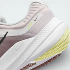 Detailed zoom on the side of the shoe, highlighting the soft foam midsole construction and the durable rubber edge of the outsole.