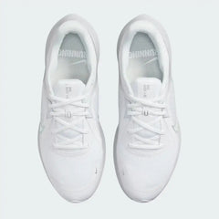Top-down view of a pair of Nike Quest 5 Women's running shoes in white, highlighting their streamlined silhouette and lace-up closure.